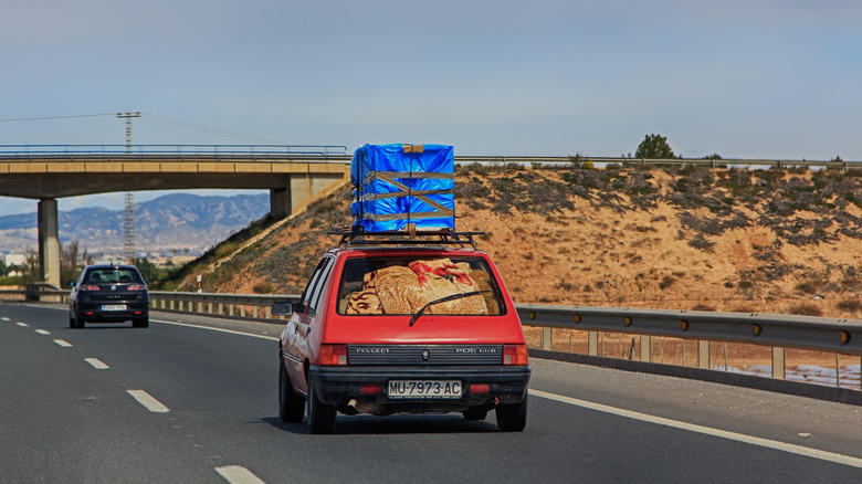 car loaded with packages on the highway