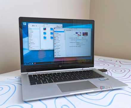 photo of a 2017 HP Elitebook x360 1030 G2 running Fedora Linux with the KDE desktop environment
