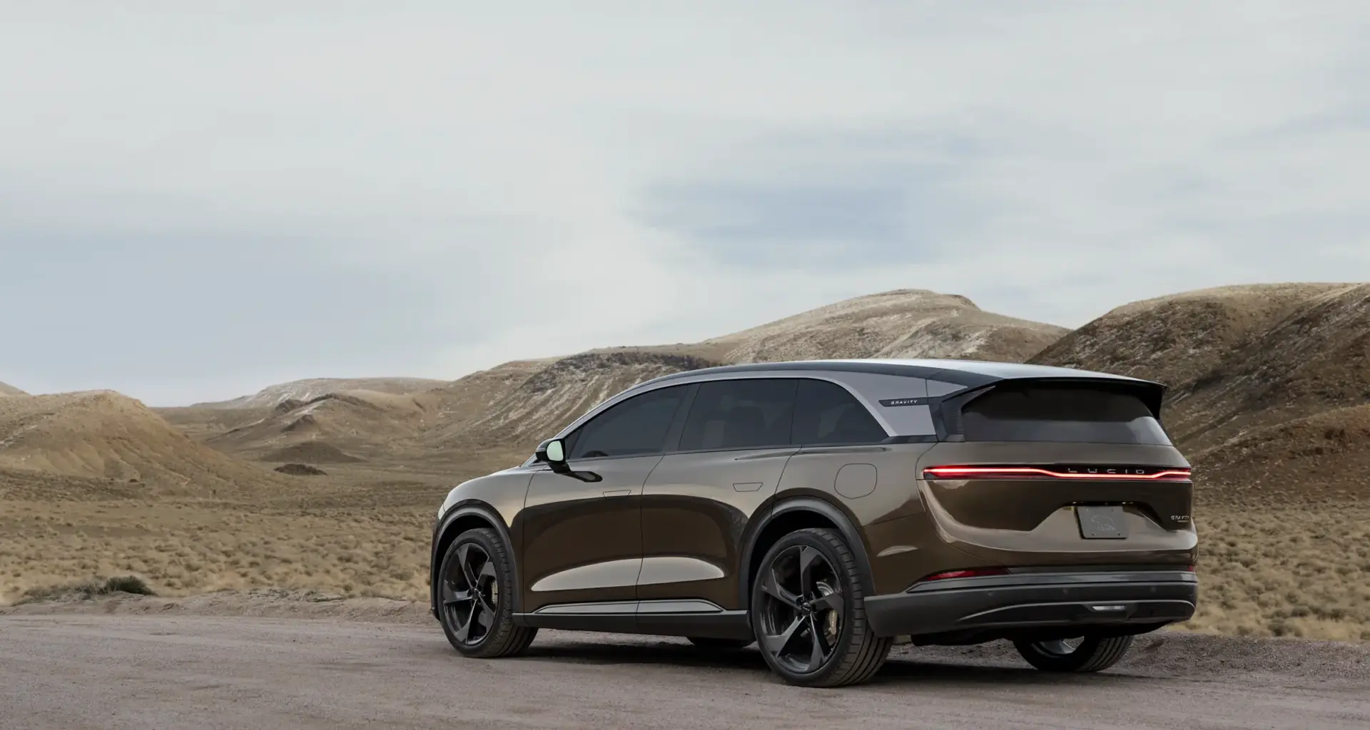 Three Lucid Airs driving down the highway.