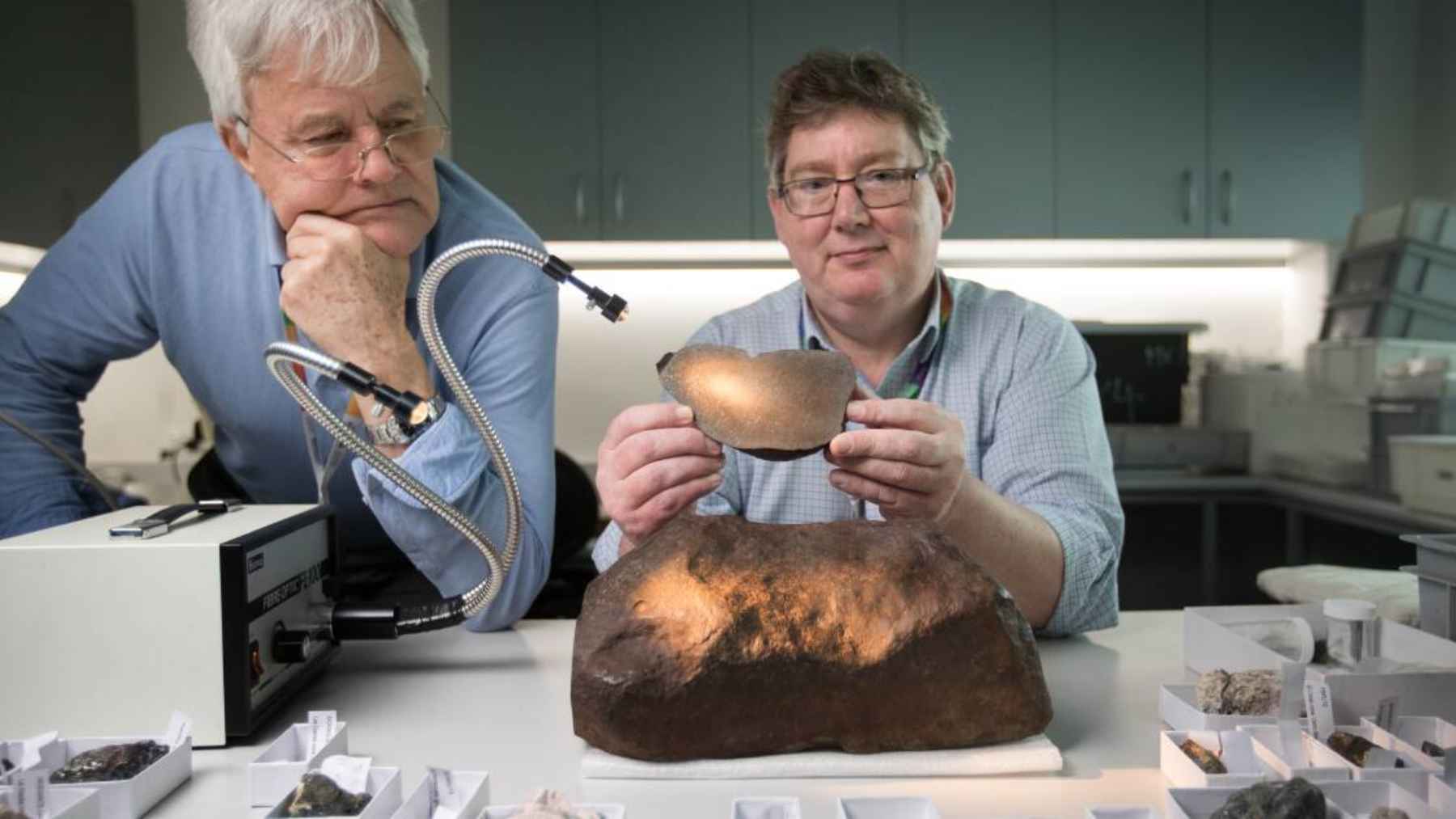 Scientists examine the Maryborough meteorite at Melbourne Museum after confirming the heavy stone found in Australia was a meteorite.