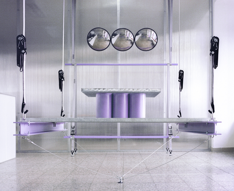 steel grates suspended from ratchet straps turn into furniture for bratislava photo lab - 3