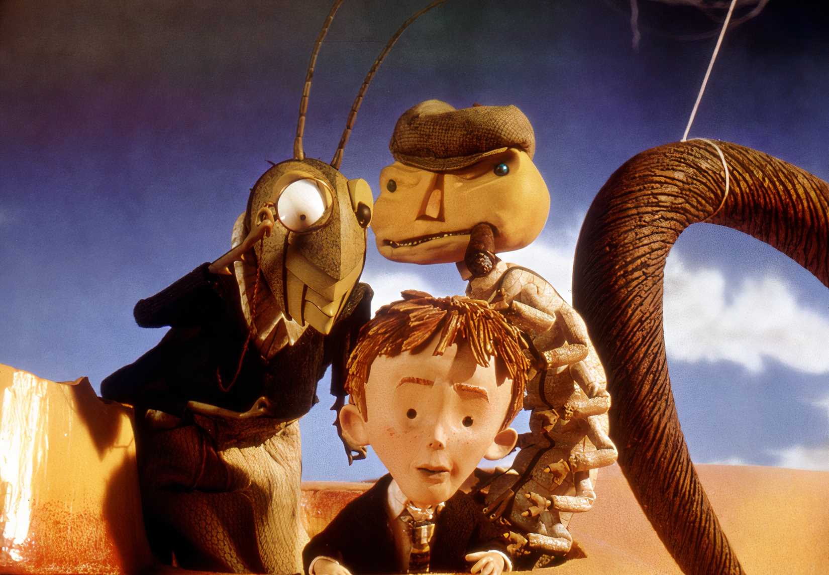 James is on top of the giant peach with the grasshopper and the centipede