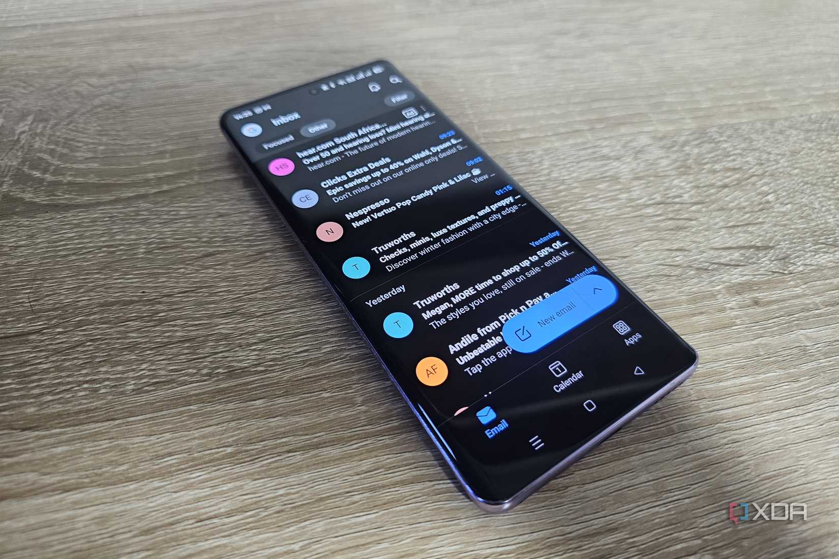 outlook mobile app with gmail inbox on smartphone