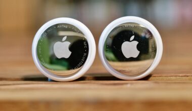 An AirTag 2nd-gen next the the first AirTag