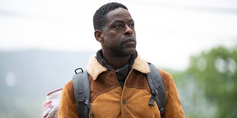 Sterling K. Brown walks outdoors with a backpack on in Paradise Season 2 Episode 4