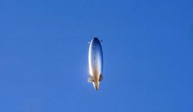 A. large silver oblong balloon-like structure floats in to the stratosphere. It is filled with helium.