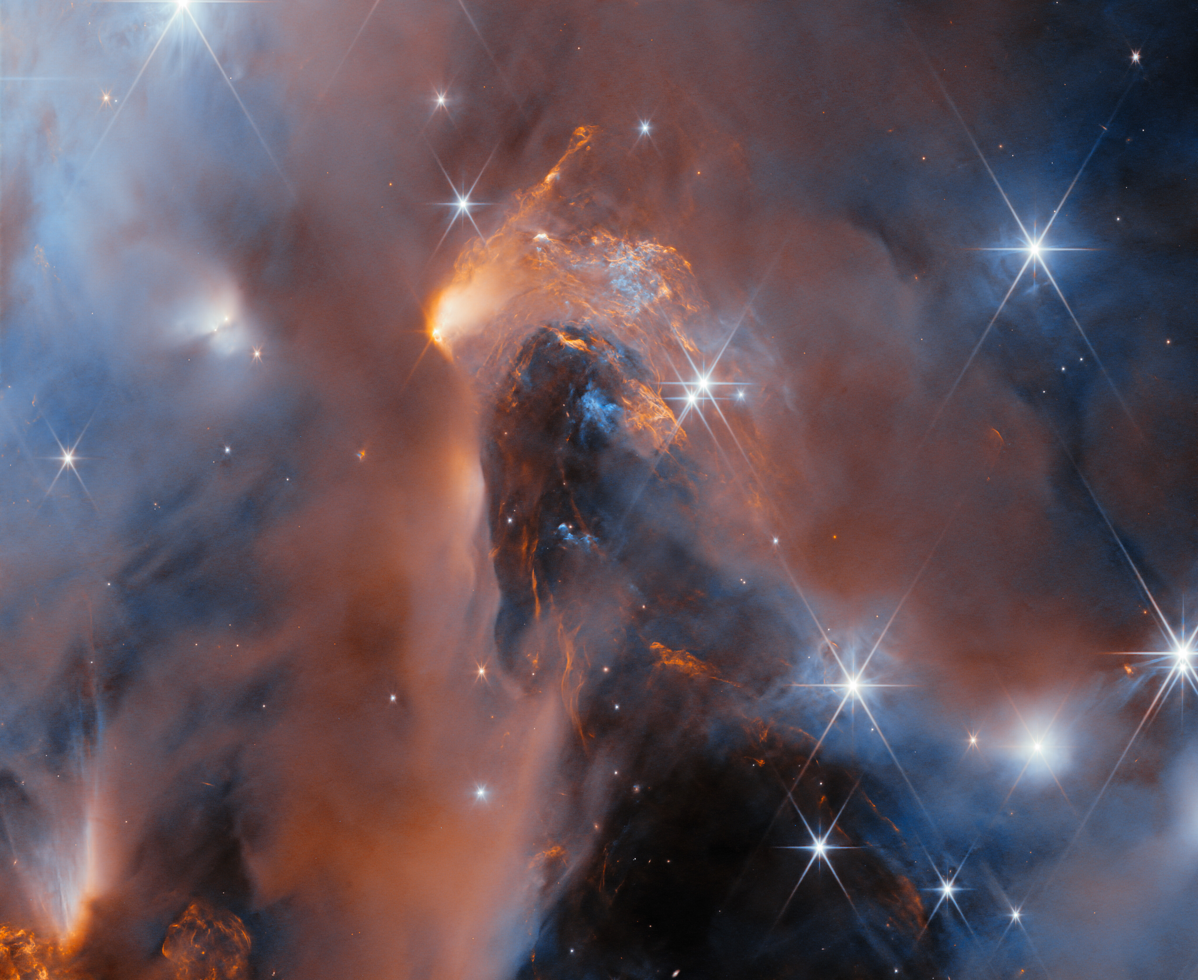 Colorful nebula with glowing gas clouds and bright stars scattered throughout, captured in deep space by a telescope, as the JWST reveals new wonders of our universe.