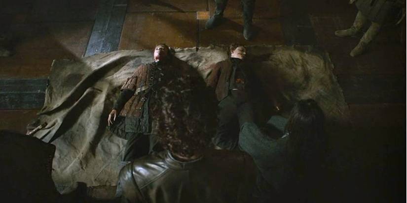 Robb Stark standing over Martyn and Willem Lannisters bodies in Game of Thrones season 3