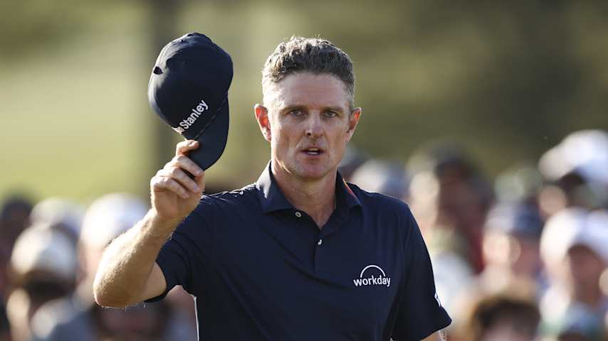 Justin Rose acknowledges the crowd on the 18th green at Augusta National. (Jared C. Tilton/Getty Images)