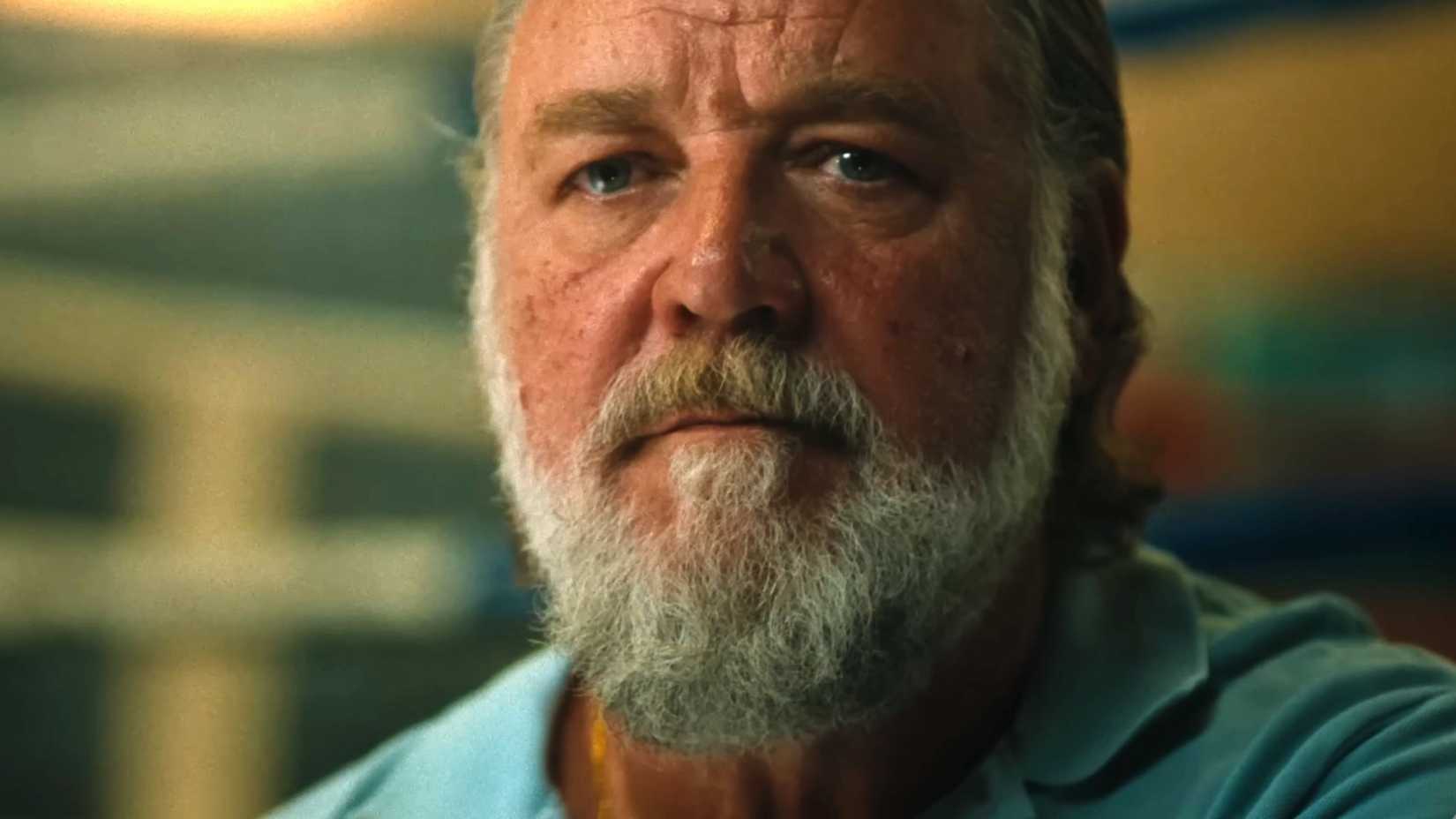 Russell Crowe is watching someone in Beast