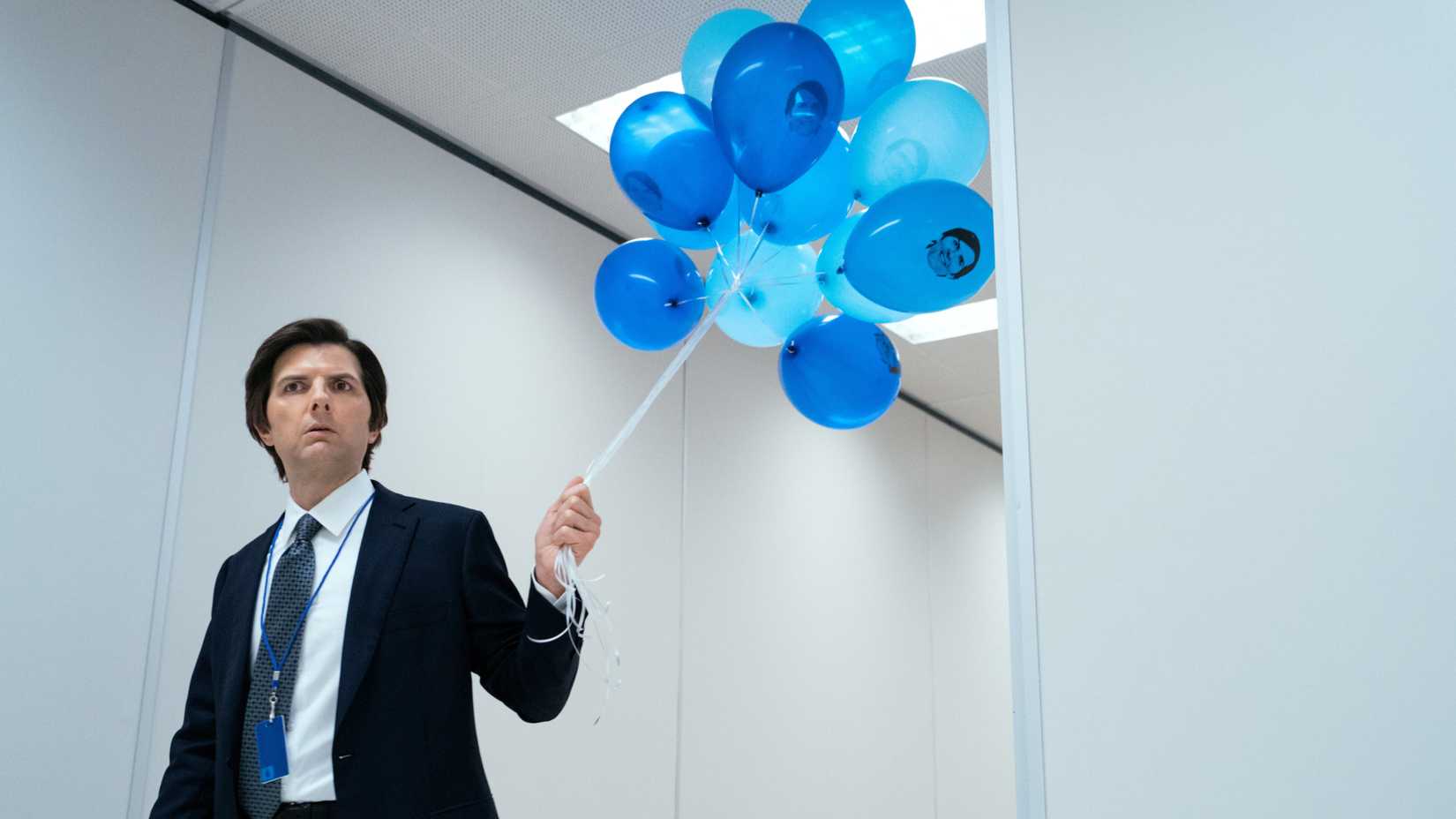 Mark Holding Balloons in Severance