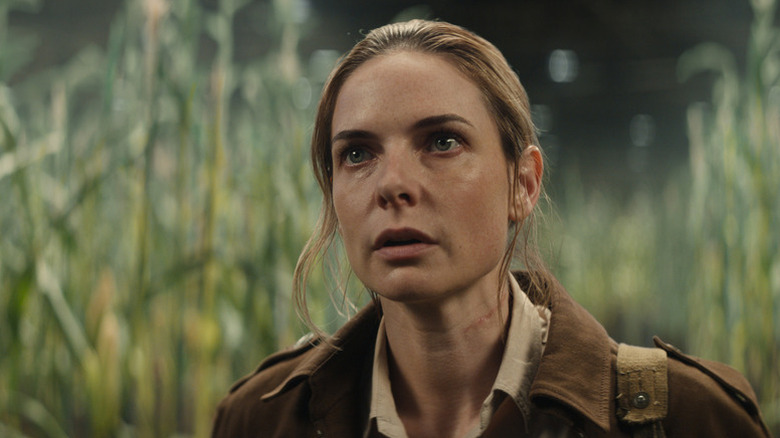 Juliette standing in front of tall grass