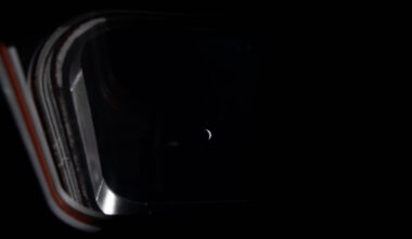 Peering out one of the four windows near the display console on the Orion spacecraft, the Earth is illuminated by the blackness of space and grows smaller as the crew journeys closer to the Moon. This image was taken by an Artemis II crew member on the fifth day of the mission.