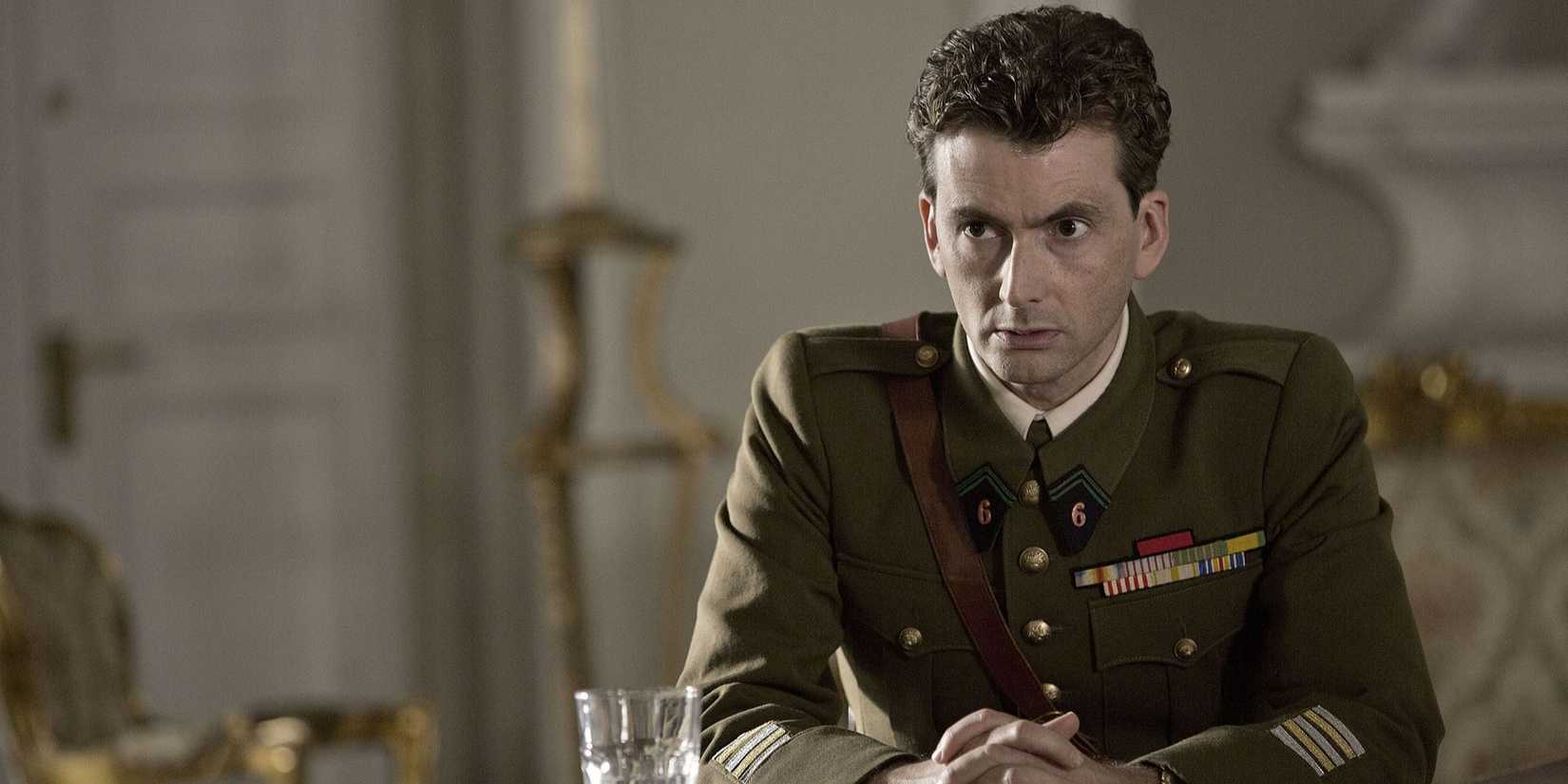 David Tenant wearing a military uniform while sitting in Spies of Warsaw