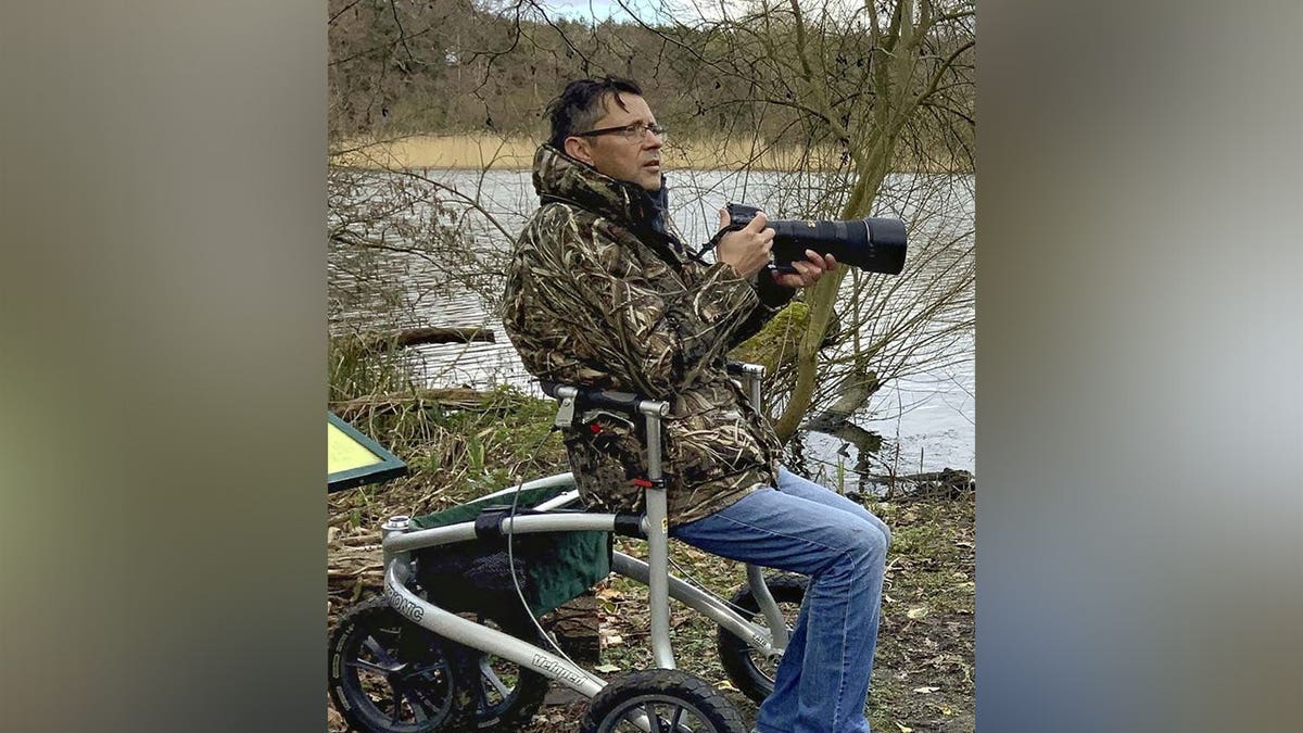 Jon Kelf doing one of his current hobbies: photography.