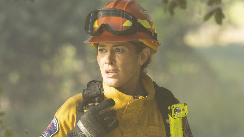 Jaina Lee Ortiz as Andy in firefighter gear in Station 19
