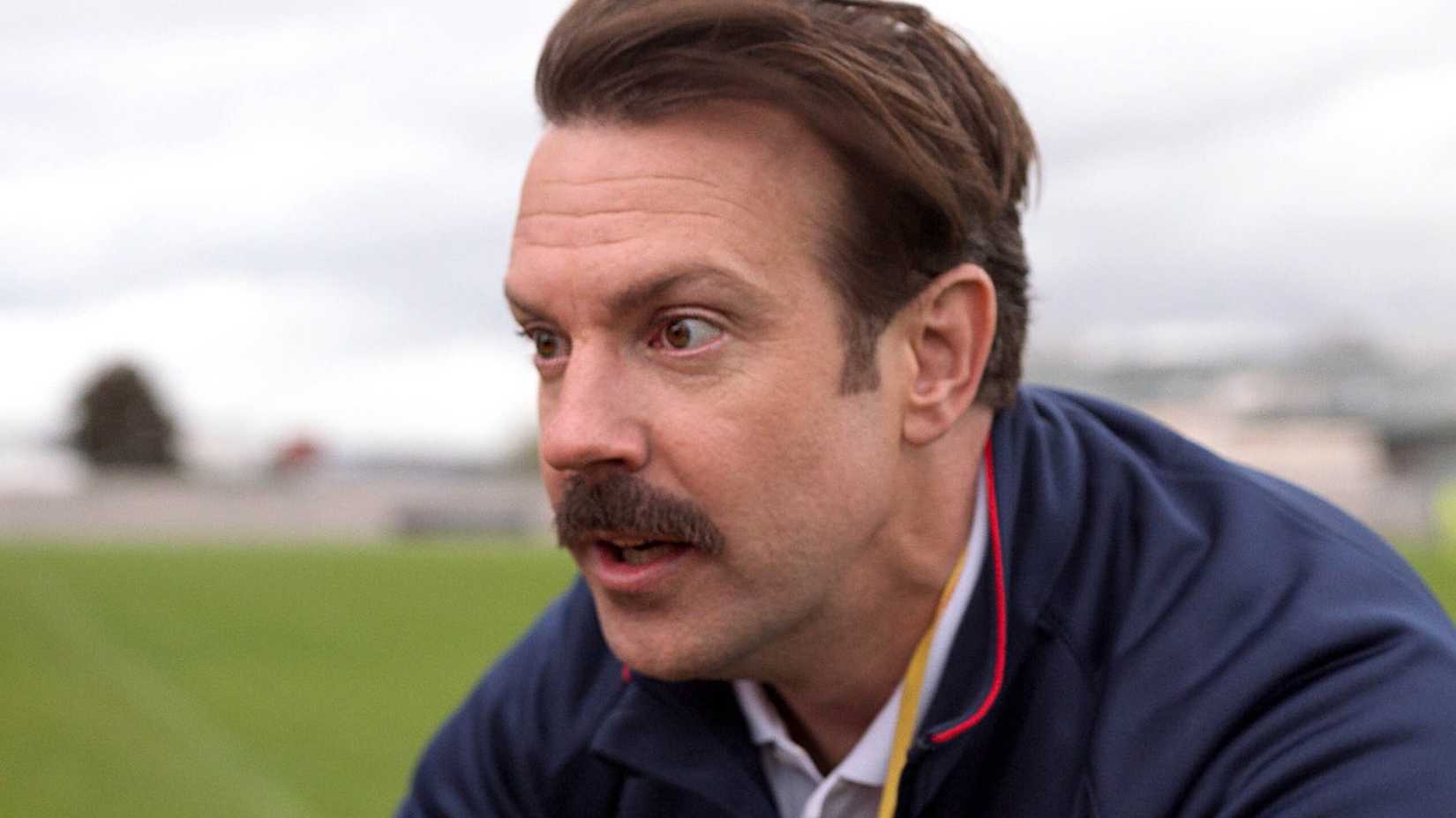 Jason Sudeikis as Ted Lasso looking shocked