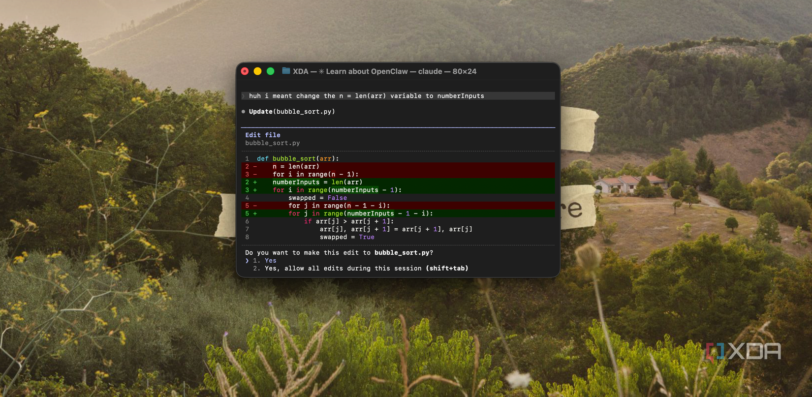terminal window showing code editor with syntax highlighting on mac desktop with mountain landscape background
