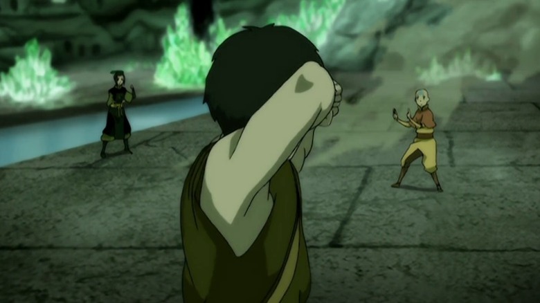 Zuko standing in an attack stance between Azula and Aang on Avatar: The Last Airbender S2E20
