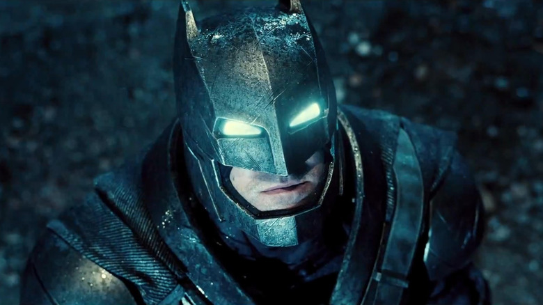 Ben Affleck as Batman in his armor looking up at the sky in Batman v Superman: Dawn of Justice