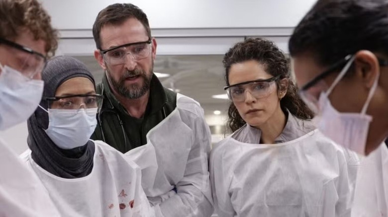 Dr. Robby and Dr. Al-Hashimi observing a procedure