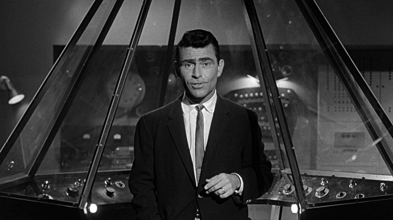 Rod Serling speaks in front of a futuristic console in The Twilight Zone (1959)