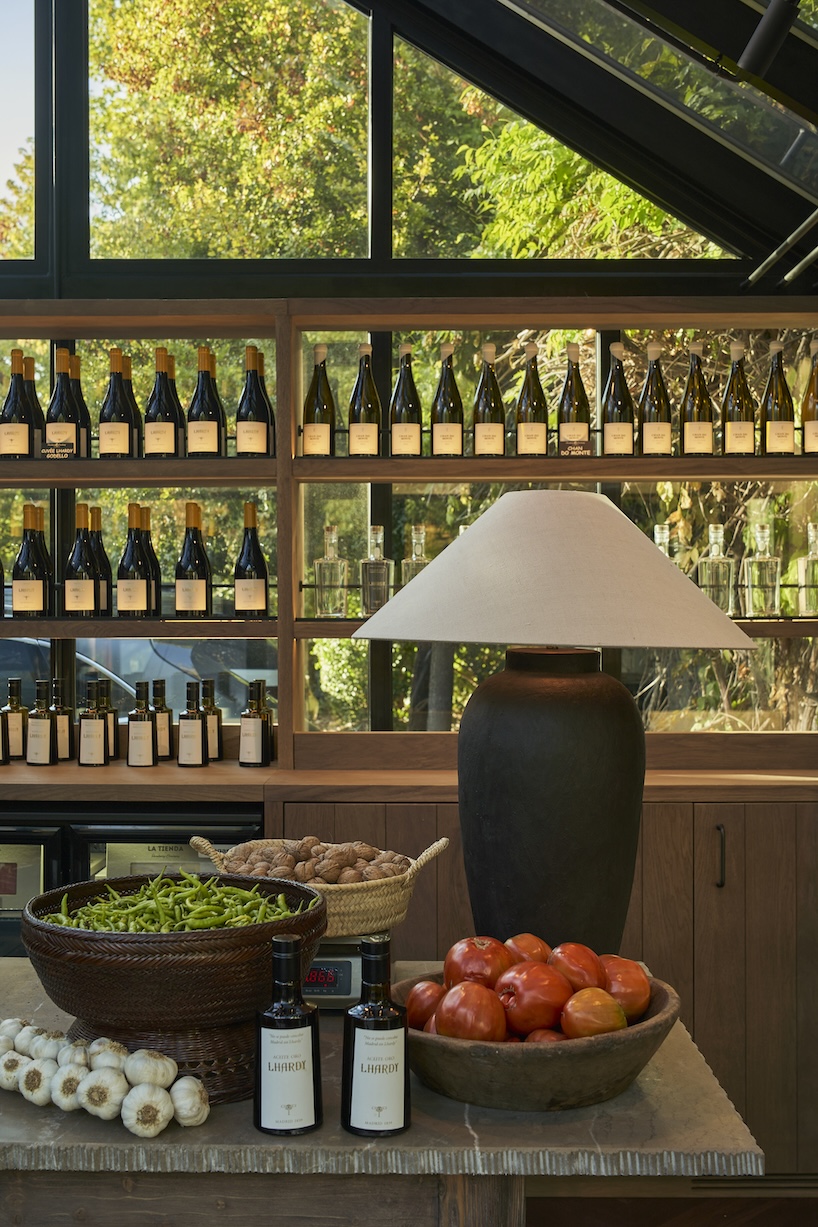 aluminum, timber, and bronze shape greenhouse retail space for culinary produce in madrid - 8