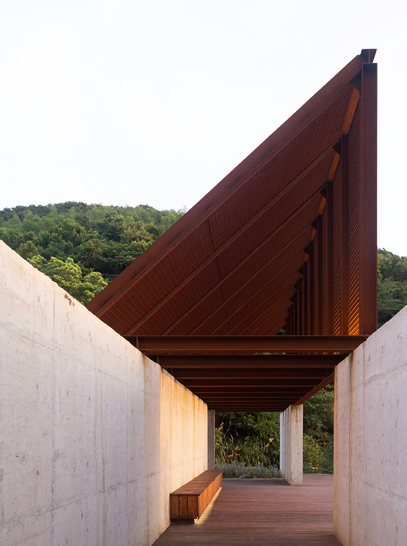 corten-clad twin pavilions frame shifting sea views along chinese coastal valley - 5