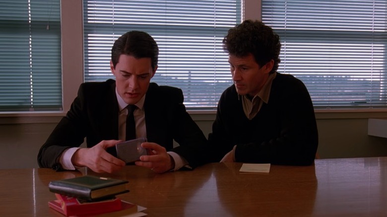 Dale Cooper and Harry S. Truman examining a video tape on Twin Peaks S1E1