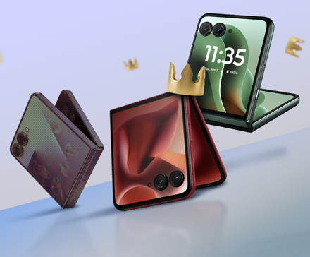 Two Motorola Razr phones next to a dirty Samsung Galaxy Z Flip, surrounded by floating golden crowns on a light blue background.