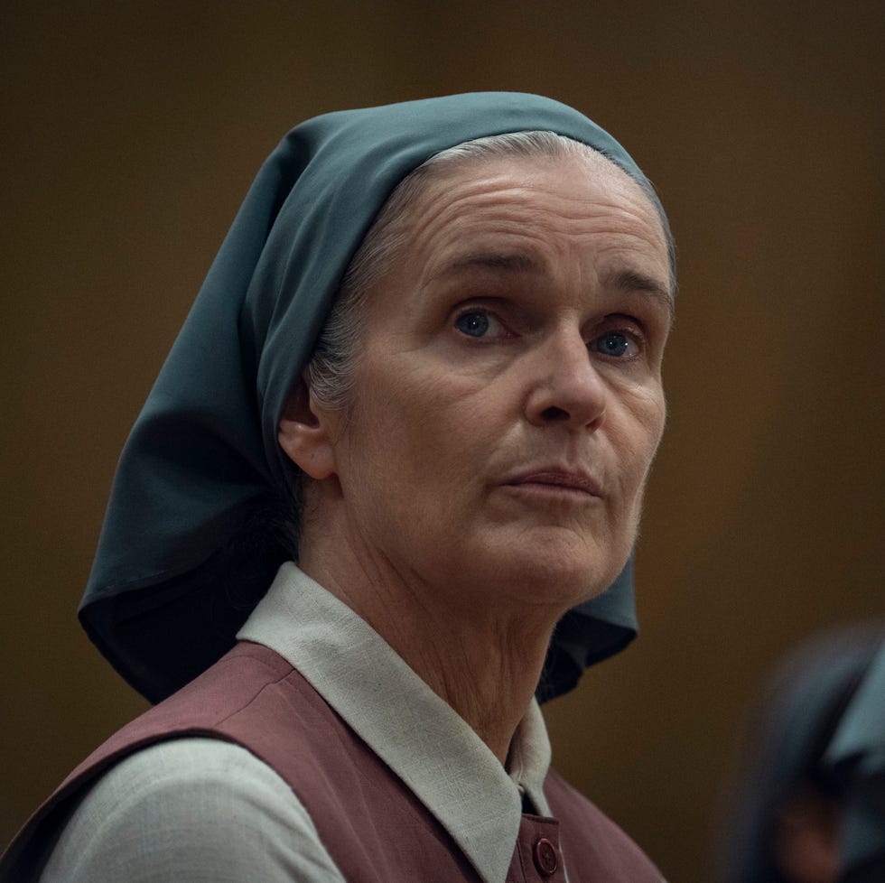 group of women in headscarves in a somber setting