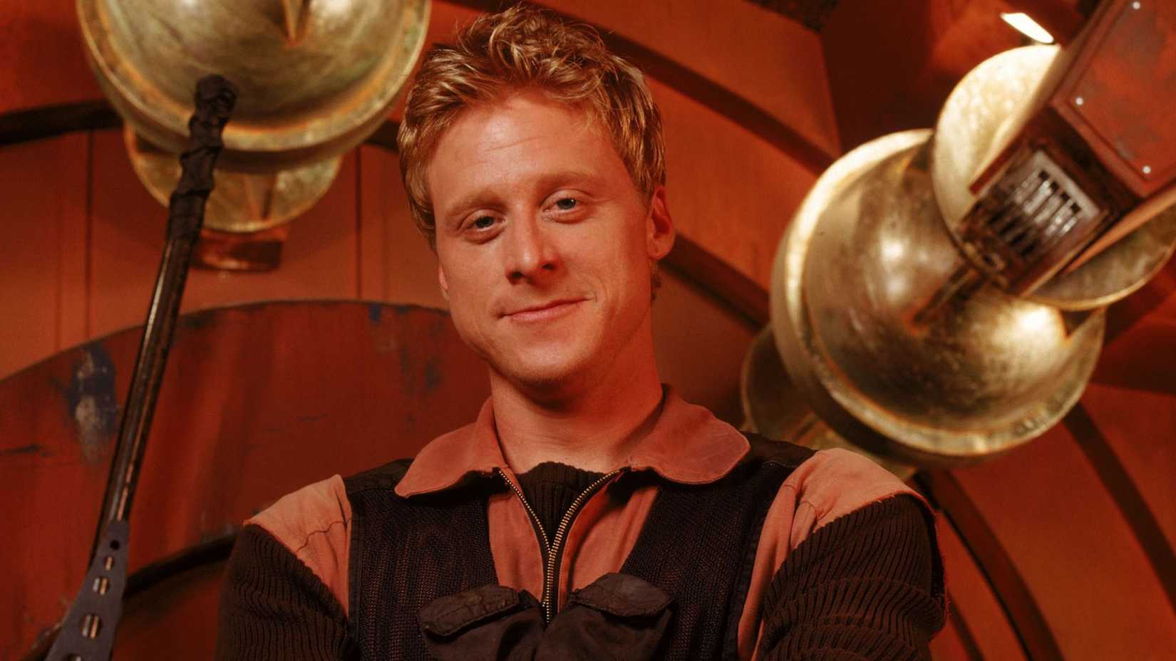 A close-up of a smiling Wash in Firefly