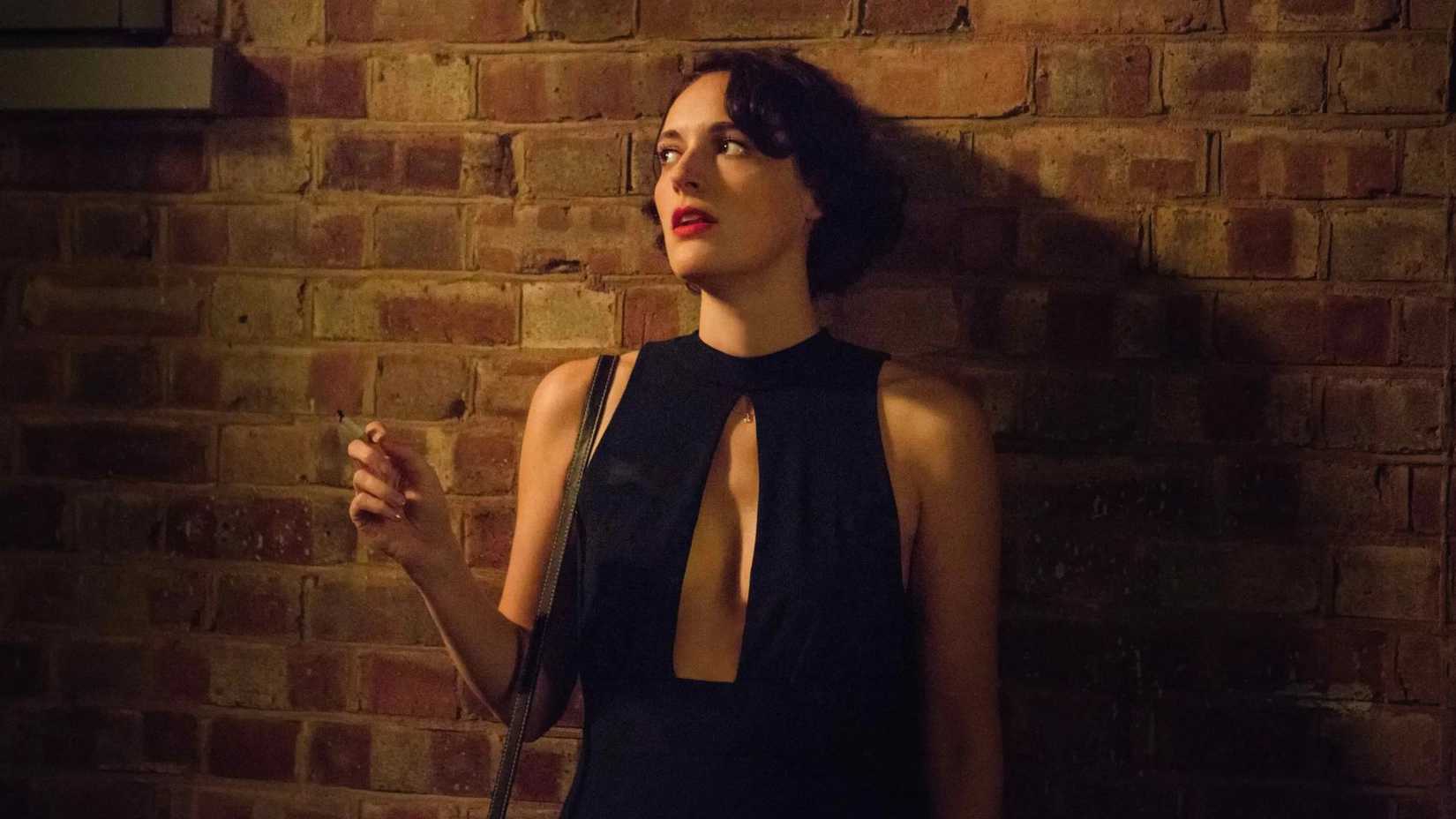 Phoebe Waller-Bridge as Fleabag, leaning against a wall