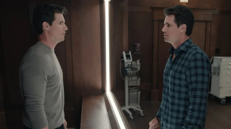 Nathan Brown (Robbie Amell) stares at a different version of himself in Upload