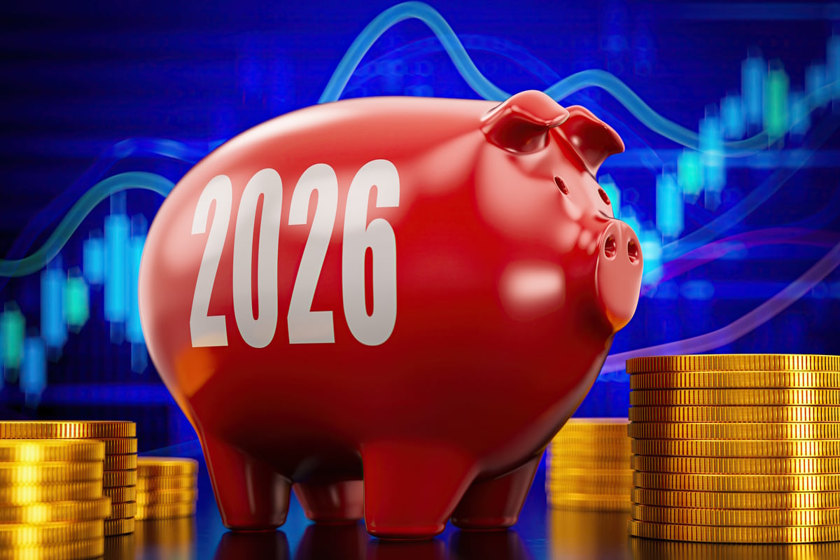A 2026 piggy bank in front of a stock chart.