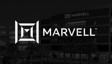 Marvell Technology logo in front of black backdrop with buildings in background.