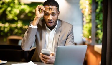 Investor looking at phone in shock.