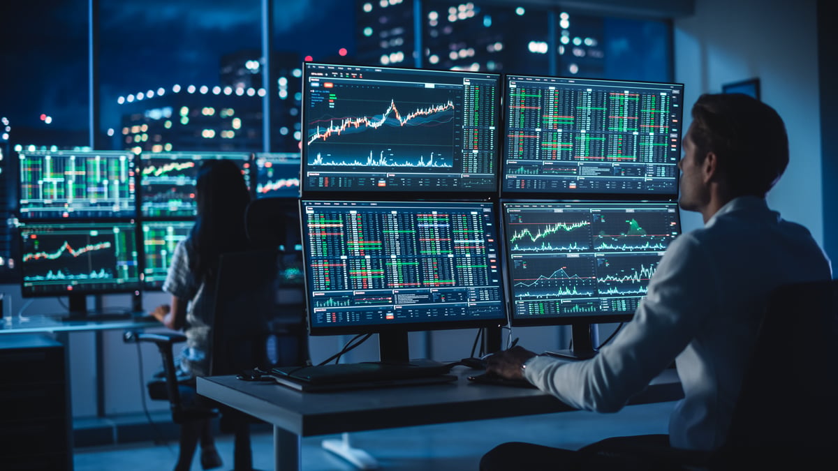 A hedge fund analyst studying a stock chart.