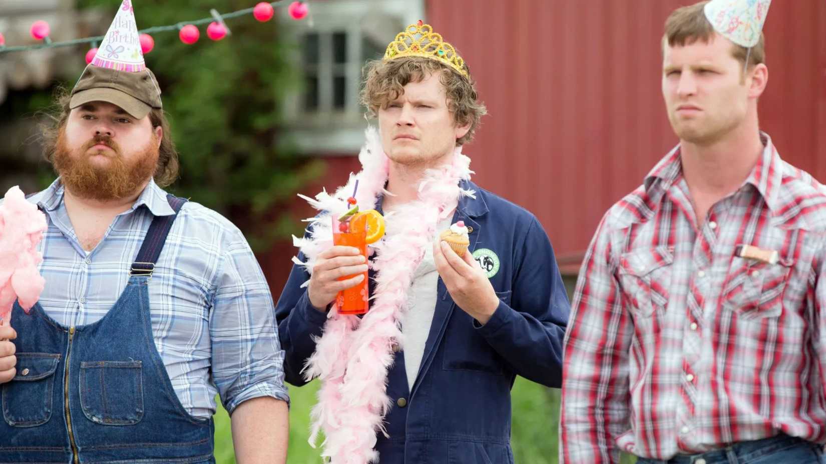 Wayne and friends looking at someone off-screen at a birthday party in Letterkenny