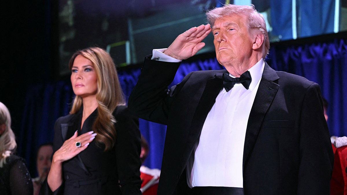 Melania Trump and US President Donald Trump pledge during the pledge of allegiance.