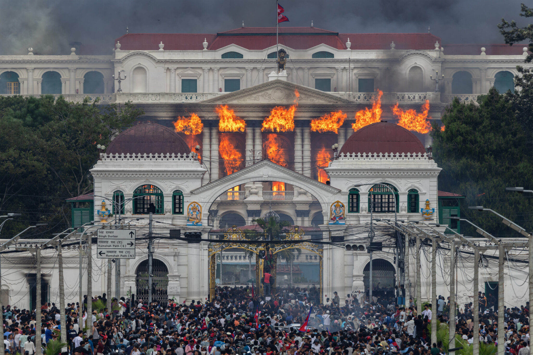 Narendra Shrestha, “Nepal’s Gen Z Uprising,” for EPA Images. Fire and smoke engulf Singha Durbar after protesters stormed and set the government complex alight during violent demonstrations. Kathmandu, Nepal, September 9, 2025.