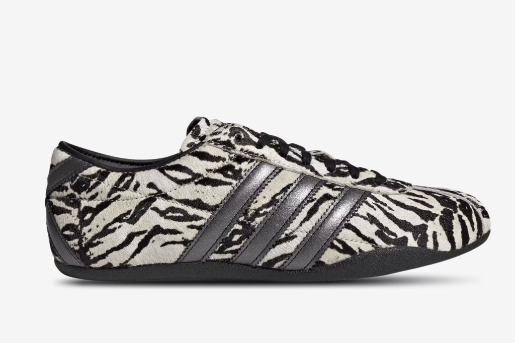Adidas shoe with zebra print pattern and metallic gray stripes.