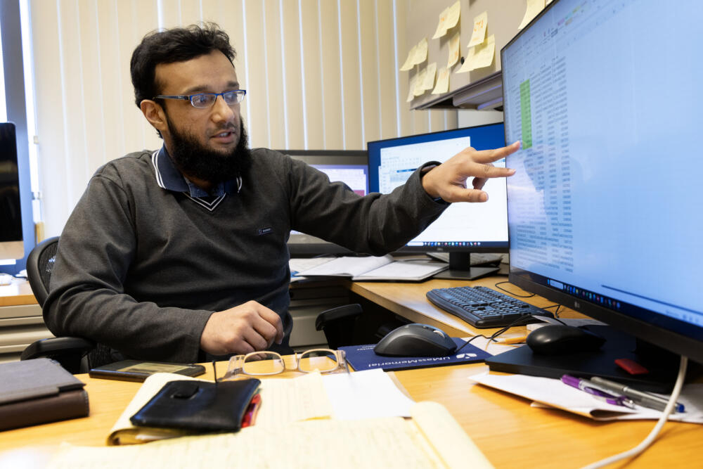 Mohammed Salman Shazeeb, associate professor of radiology at UMass Chan Medical School, shows the results of his research on AI and breast cancer. (Robin Lubbock/WBUR