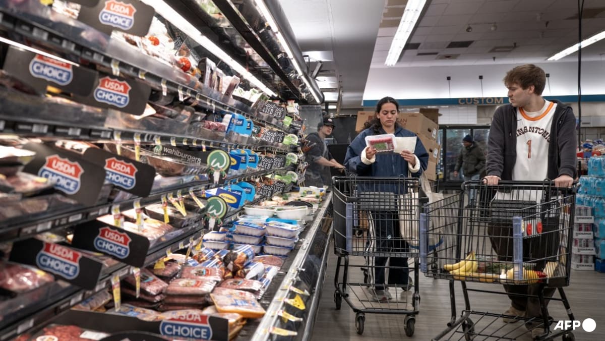 US revises first quarter growth down while inflation climbs