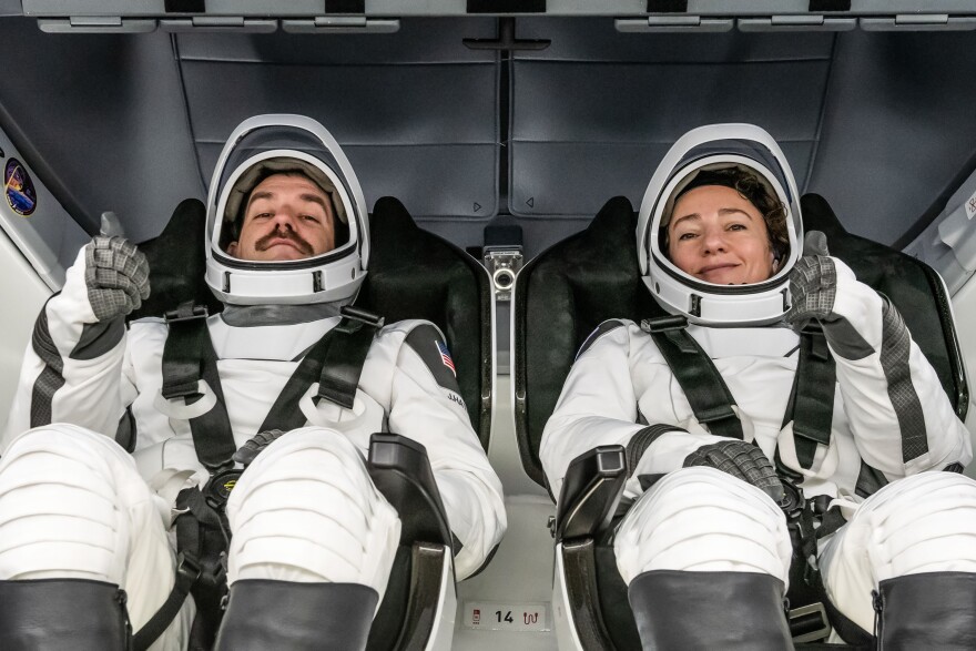 FILE: NASA astronauts (from left) Jack Hathaway and Jessica Meir, SpaceX Crew-12 Pilot and Commander respectively, are photographed in their pressure suits and inside the Dragon spacecraft during the Crew Equipment Interface Test at NASA’s Kennedy Space Center in Florida on January 12, 2026 .The goal of the training is to rehearse launch day activities and get a close look at the spacecraft that will take them to the International Space Station.