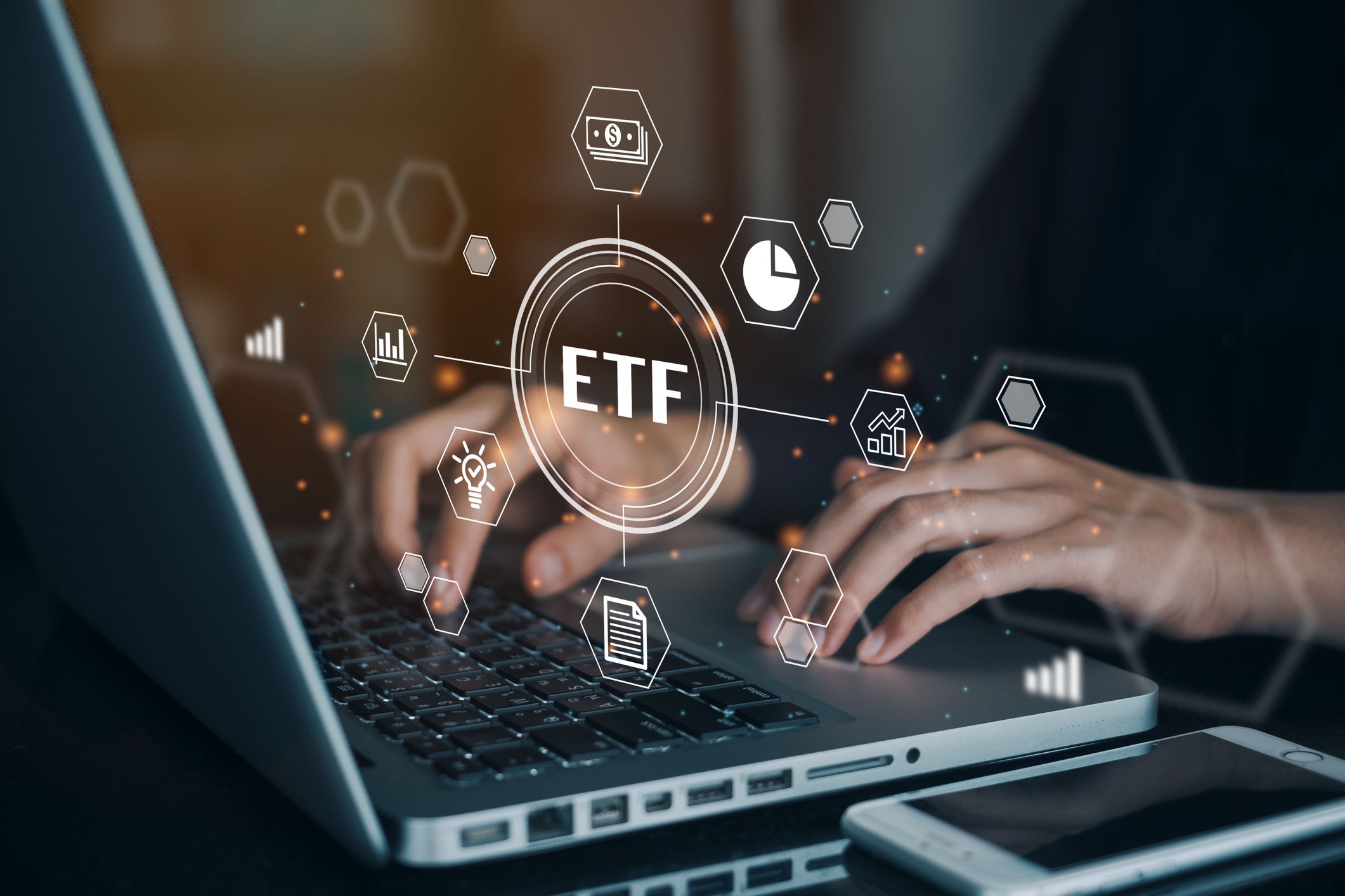 An investor buying an ETF from their laptop.