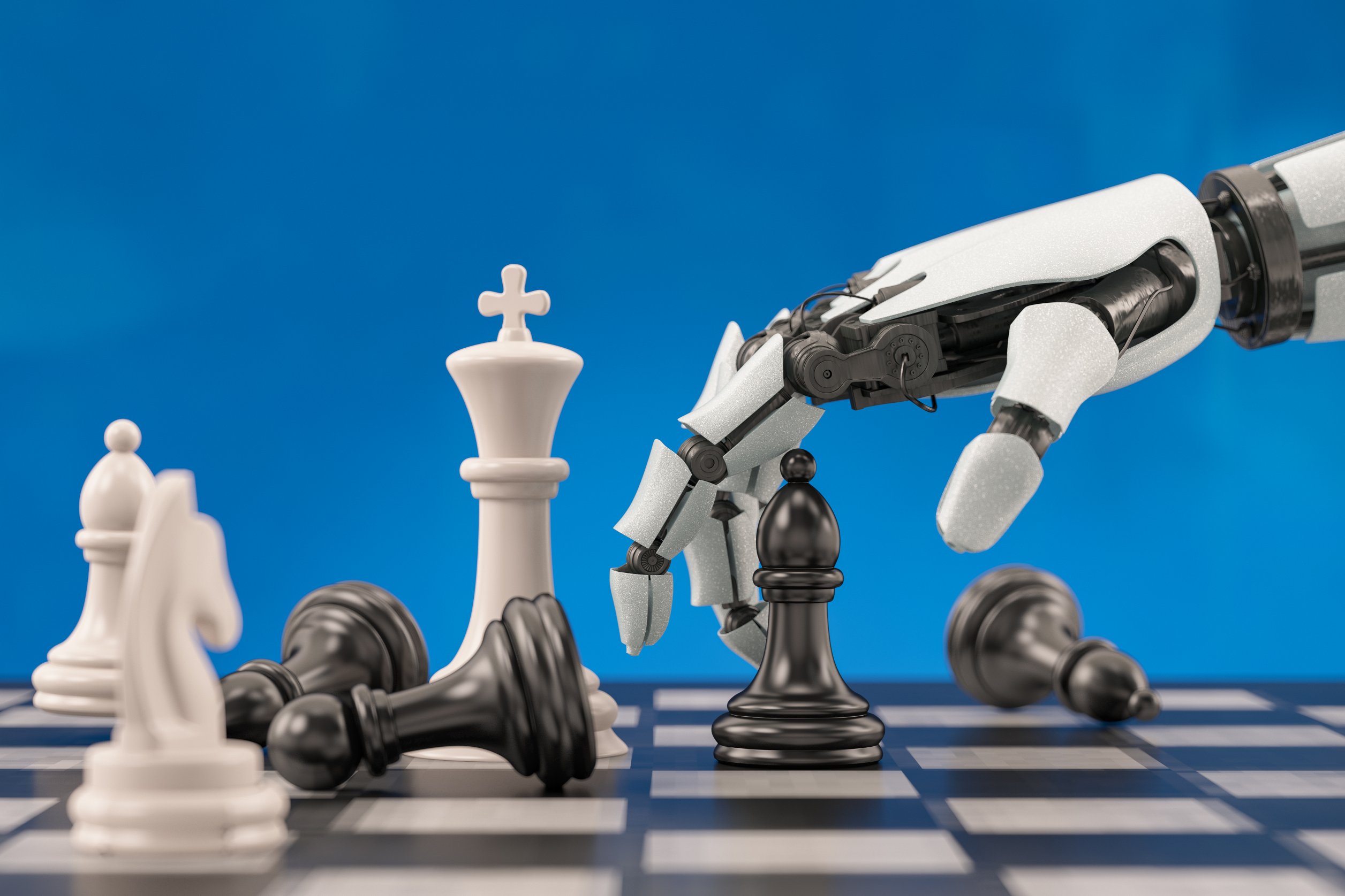 A robotic hand moves a chess piece.