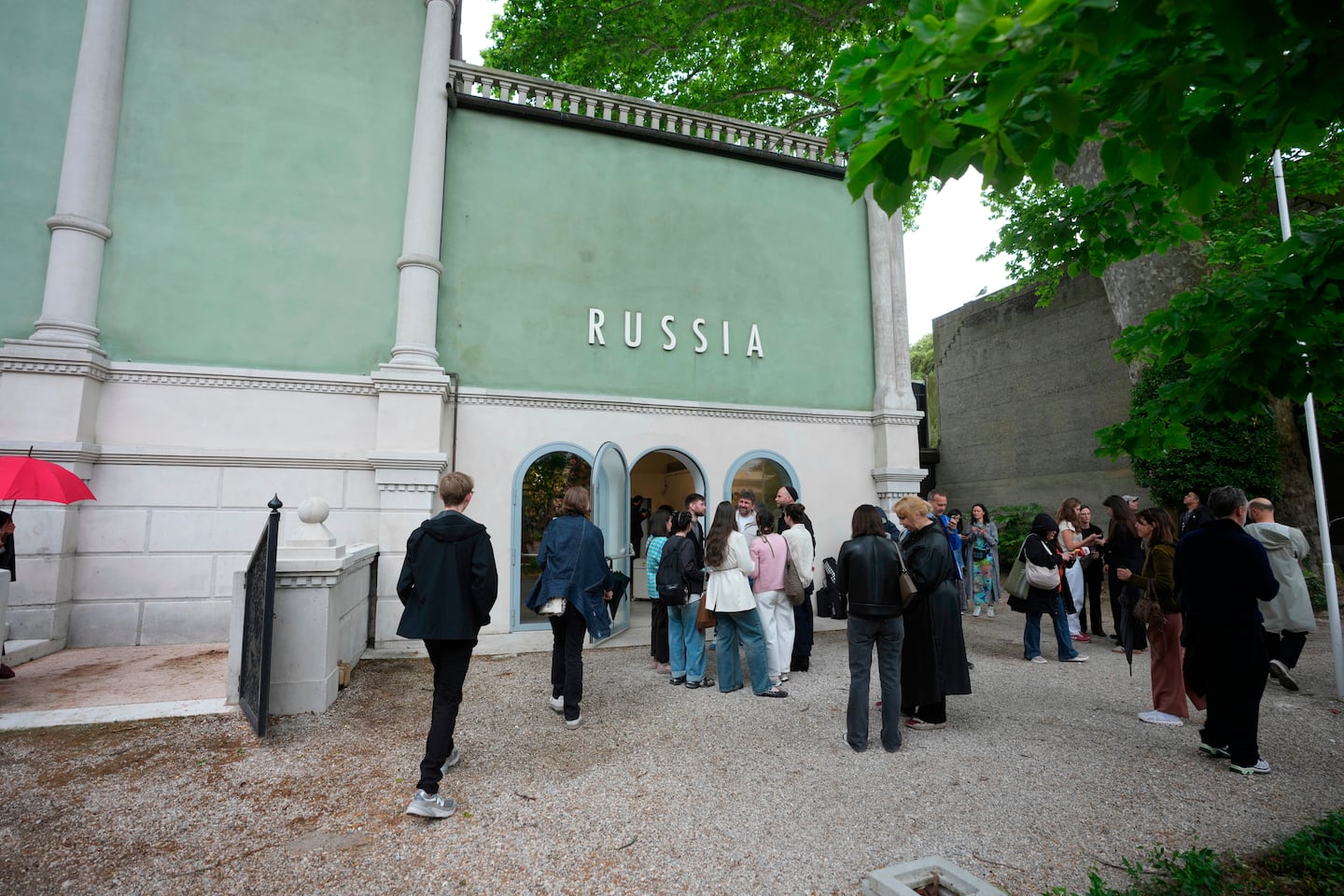 Visitors stand outside the Russia pavilion at the 2026 Venice Biennale, Tuesday, May 5, 2026. Russia has been permitted to participate in the Biennale for the first time since its invasion of Ukraine in 2022.