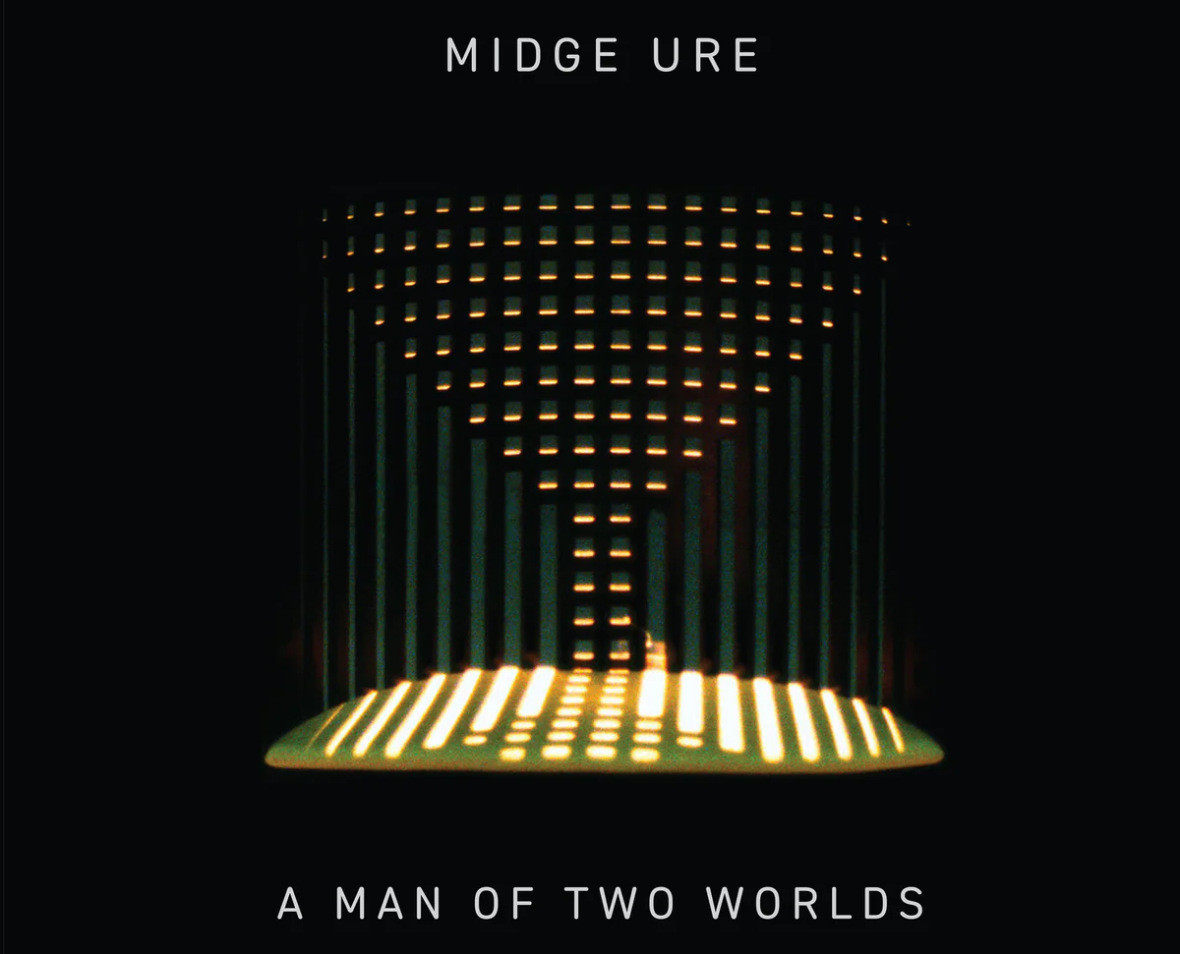 Album cover for "A Man of Two Worlds" by Midge Ure, featuring a dark background with a glowing abstract shape made of horizontal and vertical lines.