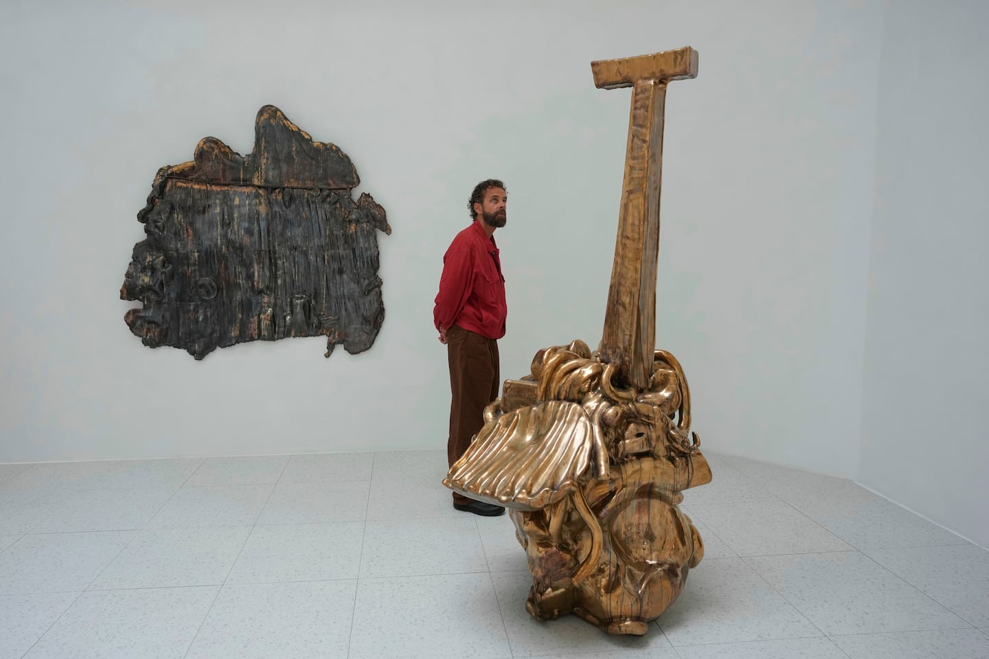 A visitor looks at sculptures by Alma Allen inside the United States pavilion at the Venice 2026 Biennale Art, in Venice, Italy.
